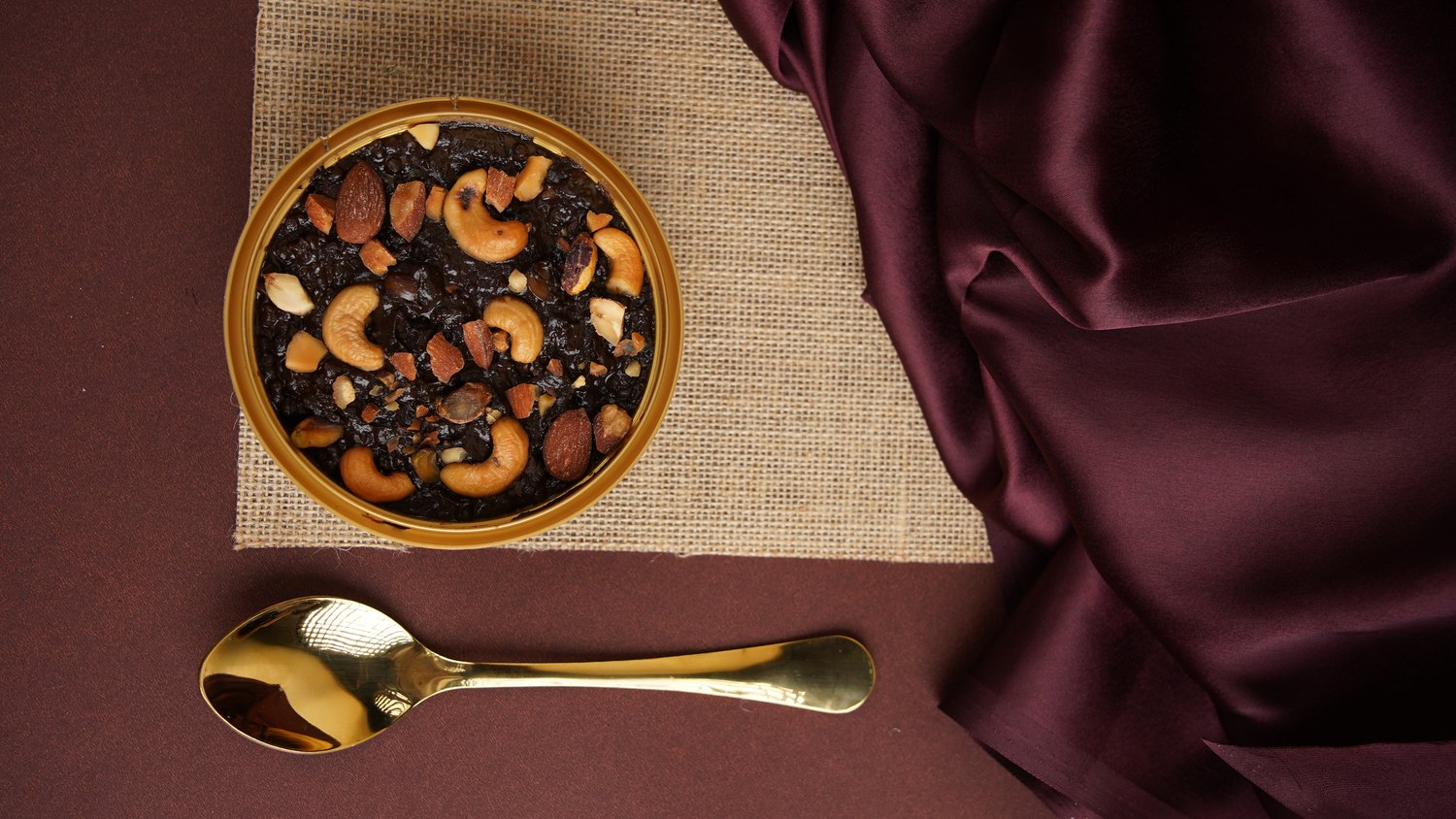 Yammora chilled dessert in a gold tub with a gold spoon